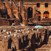 Ancient archaeological ruins outdoors featuring weathered stone structures and remnants of historic architecture