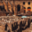 Ancient archaeological ruins outdoors featuring weathered stone structures and remnants of historic architecture