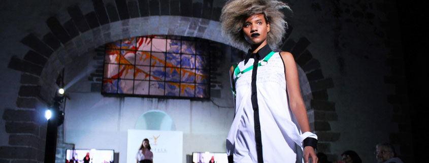 Avant-Garde-Fashion-Model-With-Experimental-Hairstyle-and-Clothing Fashion model wearing an unconventional outfit with an elaborate hairstyle, showcasing experimental fashion and creative styling