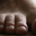 Front view of a single bare human foot resting on the ground, showing the big toe and four smaller toes