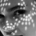 Black-and-white portrait of a woman's face showing her eyes, nose, lips, and prominent dark eyebrows