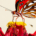Butterfly resting on a blooming flower in a garden surrounded by natural vegetation
