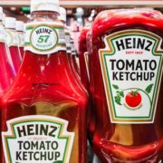 Multiple Heinz tomato ketchup bottles displaying their recognizable red ketchup and classic branded labels
