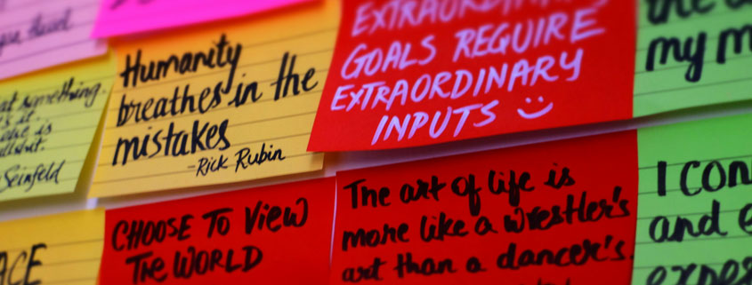 Collection of sticky notes arranged closely together displaying inspirational quotes, philosophical reflections, and motivational messages