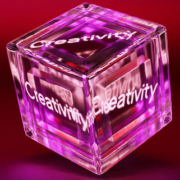 Three-dimensional cube featuring the word Creativity on each visible side