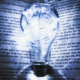 Glowing light bulb positioned at the center of an open book, illuminating its pages against a dark background