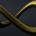 Gold-textured infinity symbol displayed against a dark background, representing endless repetition and limitless possibilities