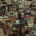 Cluster of houses built along a hillside, forming a compact residential community resembling a small town