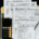 IRS Form 1040 and W-4 tax documents arranged on a clipboard with a calculator and pen