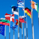 Collection of international flags from different countries displayed together, representing nations around the world