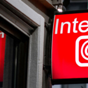Sign displaying the word Internet hanging from the exterior wall of a building