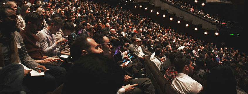 Large-Theater-Audience-Barbican-Centre-London-UK Large audience gathered inside the Barbican Centre auditorium in London, United Kingdom, with rows of spectators filling the theater