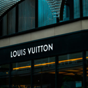 Exterior of a Louis Vuitton luxury retail building showing its distinctive architecture, brand signage, and main entrance