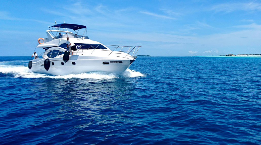 Luxury-White-Yacht-Cruising-Across-the-Open-Sea Luxury white yacht cruising across the sea with passengers on board, creating splashes of water and waves as it moves through the ocean