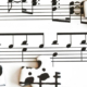 Musical notes and staff notation combined with interlocking puzzle pieces in a visual representation of music theory