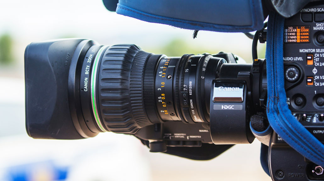 Close-up of a professional Canon ENG video camera used in broadcast journalism, television news reporting, and media production