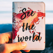 Travel passport holder featuring a world map design and the inspirational words See the World