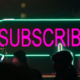Sign displaying the word Subscribe, representing subscription services and recurring membership plans