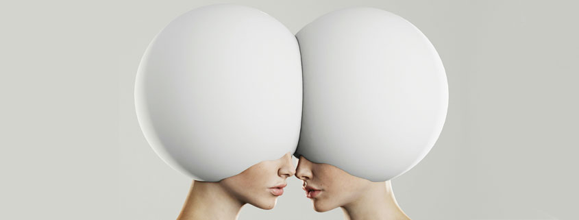 Surreal-Human-Faces-With-Eggshell-Heads-Facing-Each-Other Surreal artwork depicting two human faces with eggshell-shaped heads pressed together forehead to forehead, with only their noses, mouths, and chins visible
