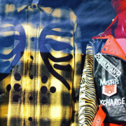 Three mannequins dressed in different fashionable outfits displayed together in a clothing store window