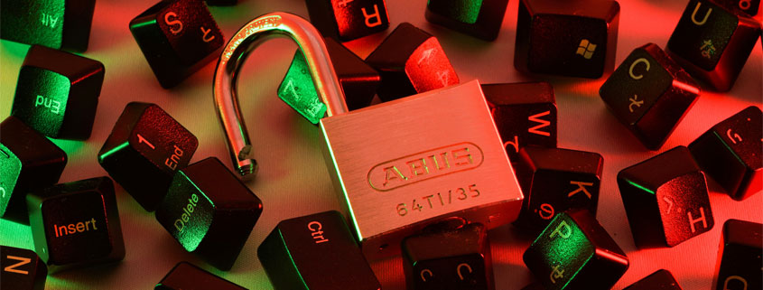 Unlocked-Padlock-Surrounded-by-Computer-Keyboard-Keys Open padlock surrounded by loose computer keyboard keys, symbolizing password security and digital access