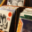 Rows of music albums with colorful covers arranged in wooden display bins along an aisle inside a record store